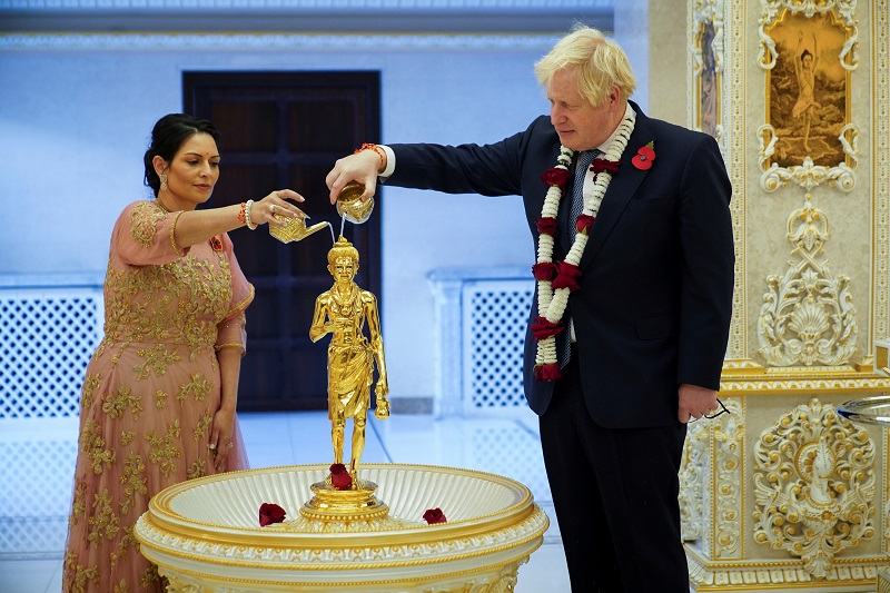 British PM Johnson and Home Secretary Priti Patel attend Diwali celebrations during a visit to the Hindu temple in London