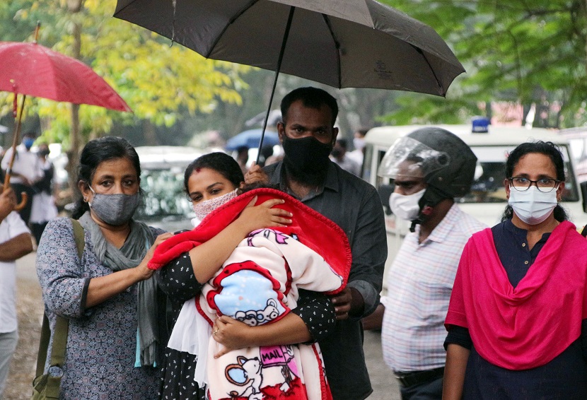 Anupama and her husband Ajith walkout from the Vanchiyoor court, with their one year old son Aiden