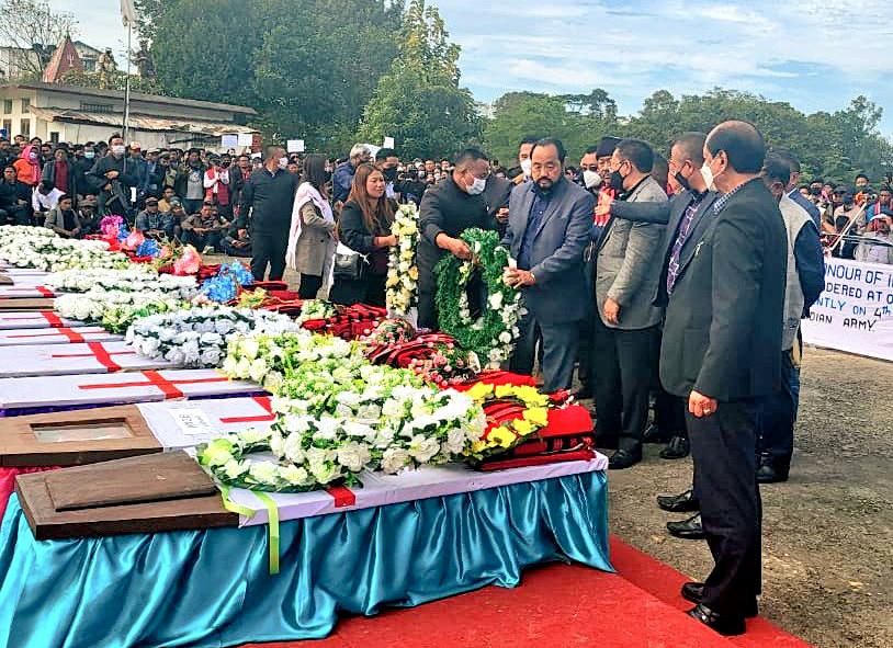 Nagaland Minister for Health and Family Welfare S Pangnyu Phom and other dignitaries laying a wreath at the mortal remains of those who lost their lives in an unfortunate incident