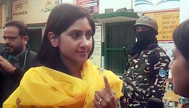 BJP candidate from Raebareli Sadar seat, Aditi Singh, shows her ink marked finger after casting her vote