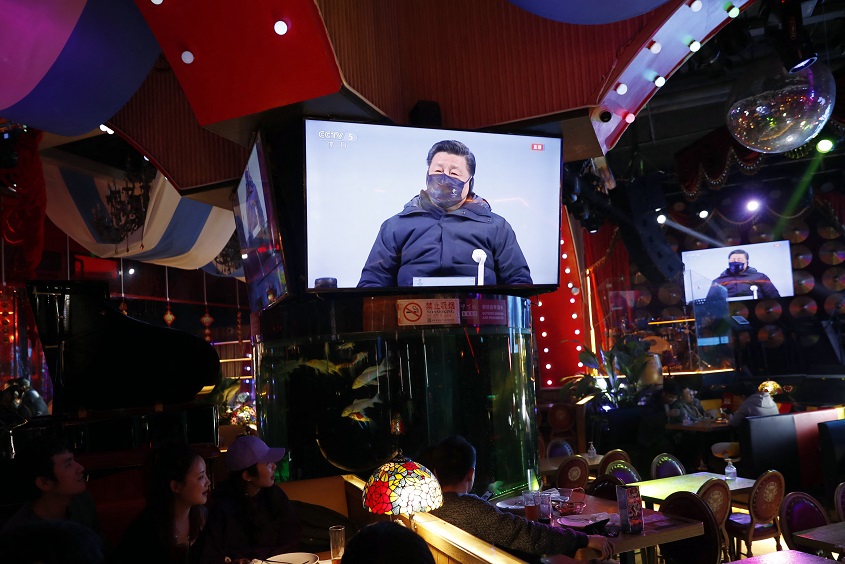 Screens broadcasting the Beijing 2022 Winter Olympics opening ceremony, at a restaurant in Beijing