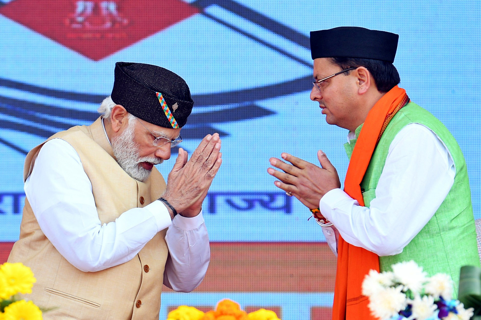 Narendra Modi attending the oath-taking ceremony of Pushkar Singh Dhami
