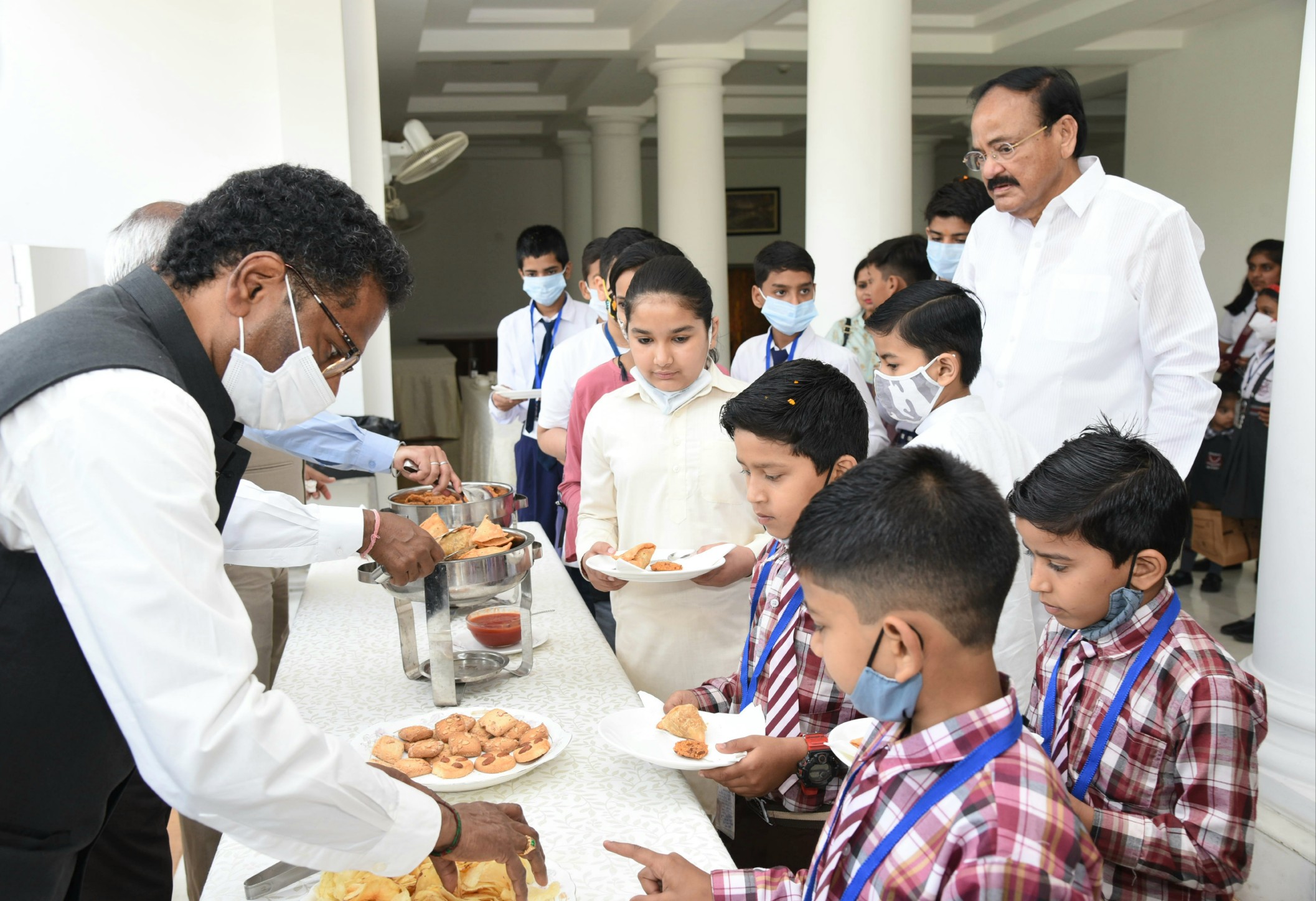 4-- Naidu celebrates Holi with school children by Manmohan