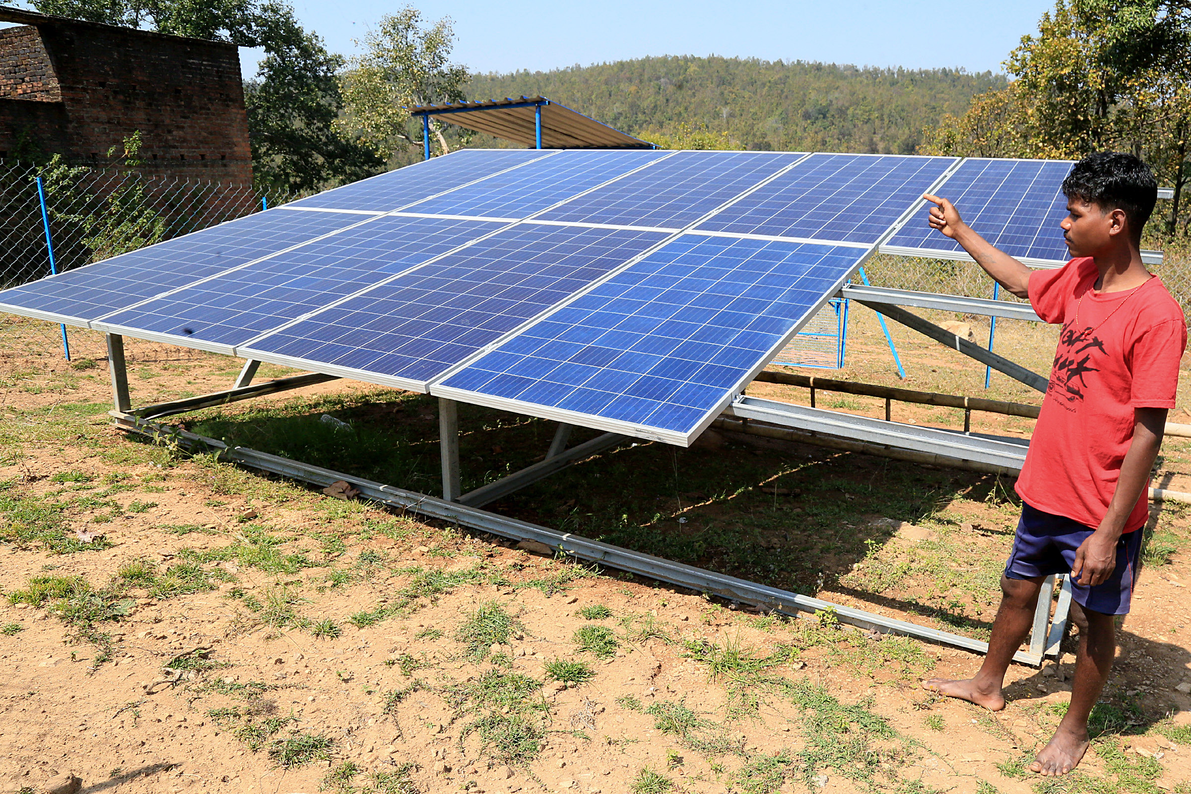 A villager shows the recently installed solar system by the Jharkhand govt