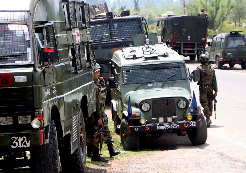 Security personnel patrol near the encounter site in Anantnag