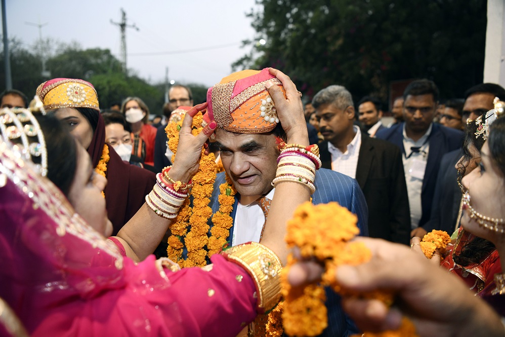 India's G20 Sherpa Amitabh Kant being presented with a turban on his arrival at Shilpgram crafts village