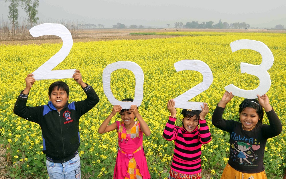 Children celebrating the upcoming New Year 2023 at a village near Balurghat