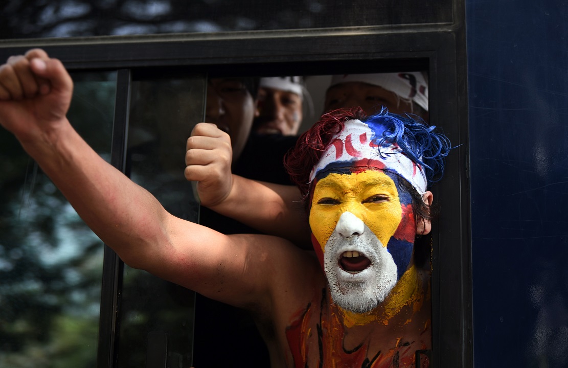 A Tibetan Youth Congress supporter detained during a protest against Chinese government