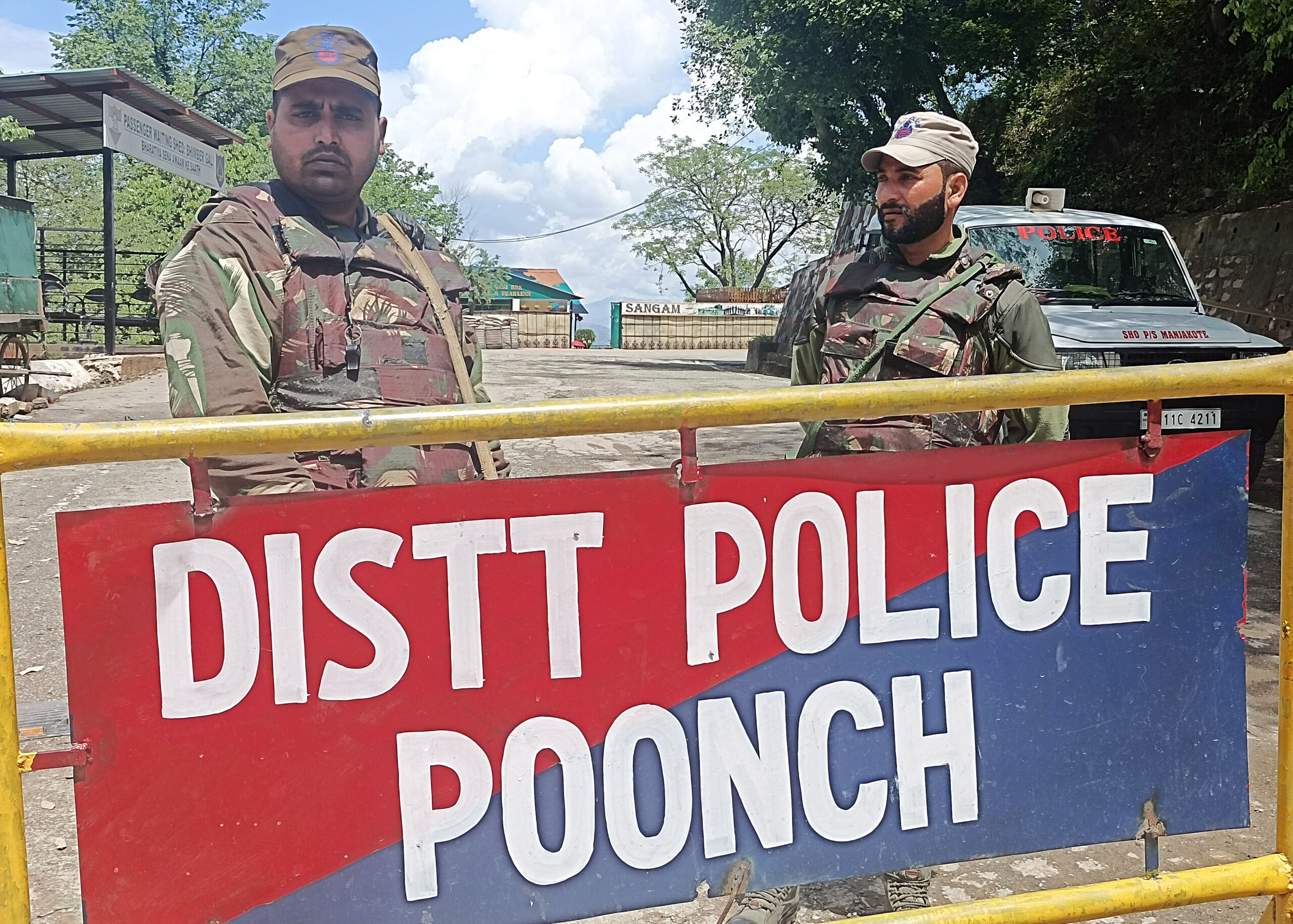 Security personnel stand guard at the site where five soldiers lost their lives in a terror attack