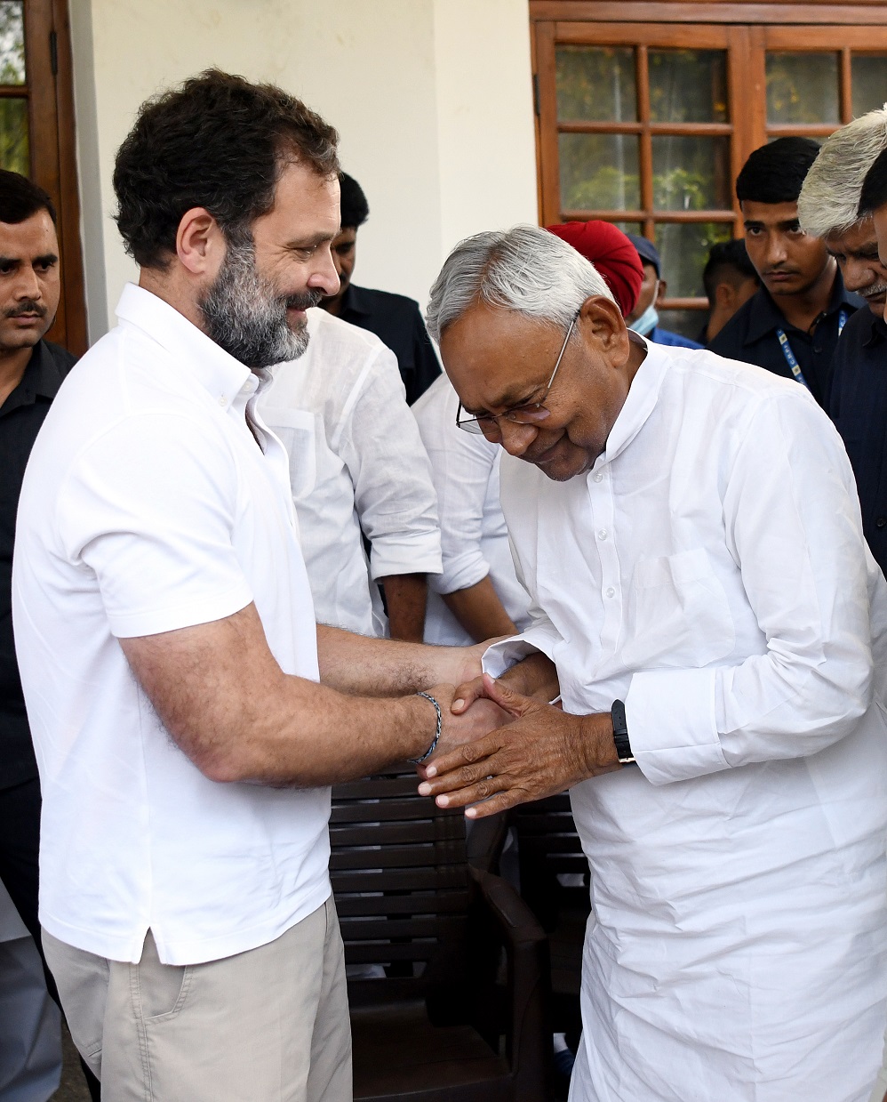 Nitish Kumar and Rahul Gandhi exchange greetings after a joint press conference with Mallikarjun Kharge