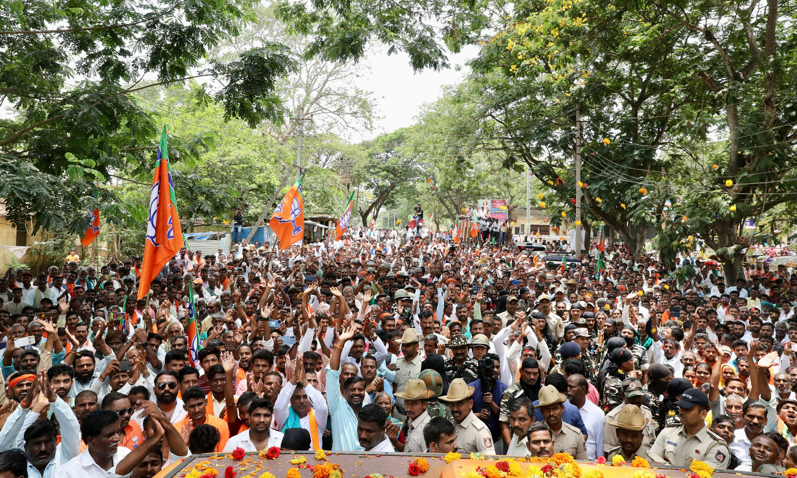 BJP supporters attend a roadshow of JP Nadda