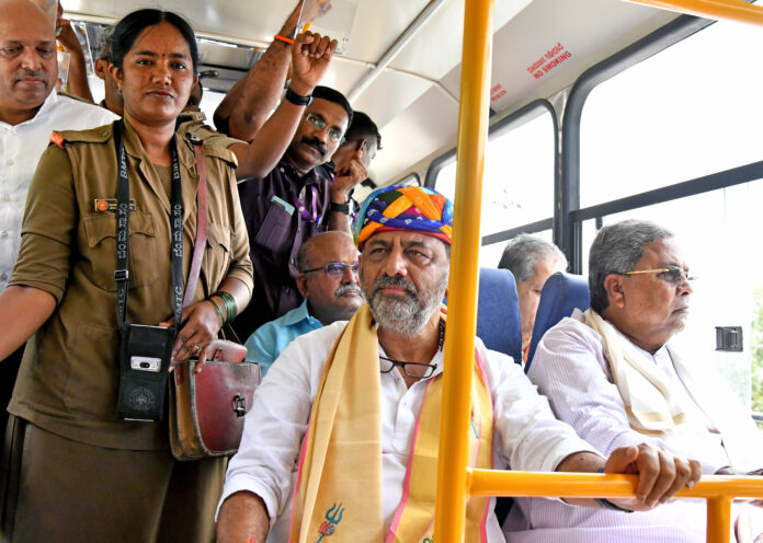Siddaramaiah with DK Shivakumar during the inauguration of free travel for women in KSRTC and BMTC buses