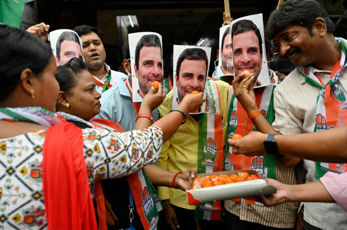 Congress supporters celebrate as Supreme Court gave an interim order to stay on party leader Rahul Gandhi's conviction