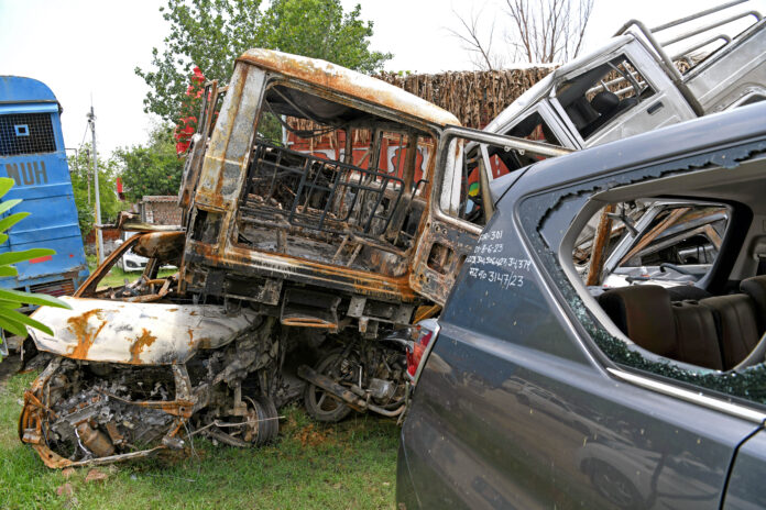 Damaged and burnt vehicles after the violent clash