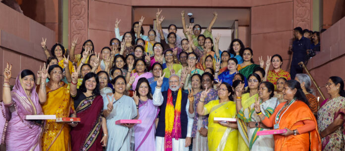 PM Narendra Modi and women MPs celebrate the passing of the Women's Reservation Bill