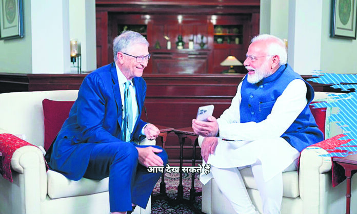 Prime Minister Narendra Modi and Microsoft co-founder Bill Gates interact with each other