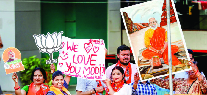 PM Narendra Modi holds a roadshow in support of the BJP candidate Alok Sharma Bhopal, Apr 25 (ANI): Bharatiya Janata Party (BJP) supporters during a roadshow held by Prime Minister Narendra Modi (Unseen) in support of the party candidate from Bhopal seat Alok Sharma for the second phase of the Lok Sabha elections, in Bhopal on Wednesday. (ANI Photo)