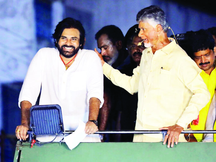 Krishna, Apr 18 (ANI): Telugu Desam Party (TDP) president N. Chandrababu Naidu with JanaSena Party chief Pawan Kalyan hold the roadshow ahead of Lok Sabha and State Assembly Polls, at Machilipatnam, in Krishna on Wednesday. (ANI Photo)