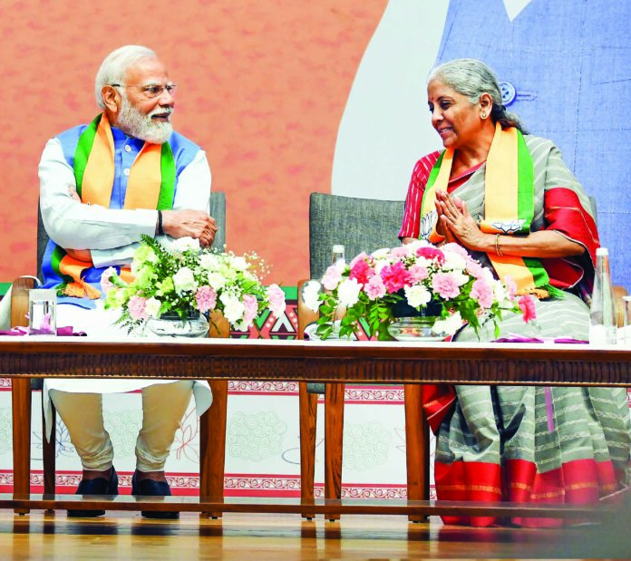 PM Modi and FM Nirmala Sitharaman TSG
