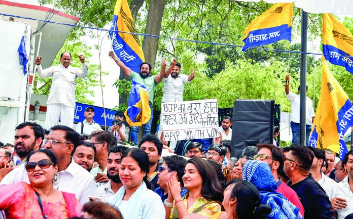 AAP workers attend a party event organised for Delhi CM Arvind Kejriwal