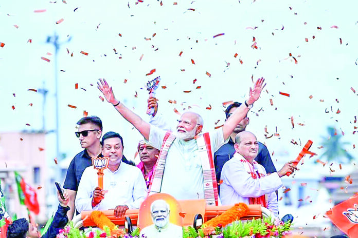 Prime Minister Narendra Modi holds a roadshow