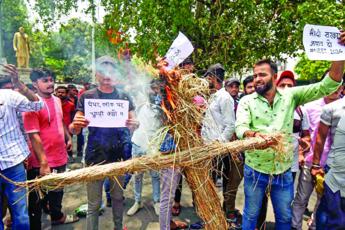 NEET_TSG Students burn an effigy during their protest against the NEET UG entrance exam paper leak, in Patna on Saturday. ANI