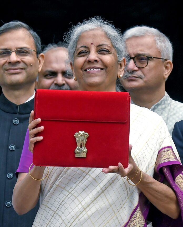 Union Finance Minister Nirmala Sitharaman shows the Budget tablet