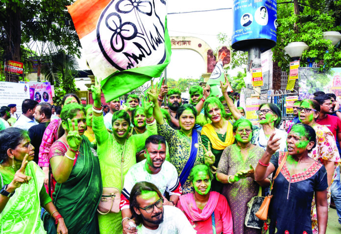 TMC supporters celebrate the victory of the party candidate Supti Pande