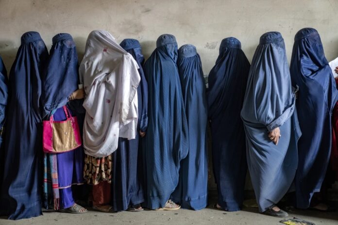Afghan women wait to receive food rations distributed by a humanitarian aid group, in Kabul, Afghanistan, in May 2023. (File) Afghan women wait to receive food rations distributed by a humanitarian aid group, in Kabul, Afghanistan, in May 2023. (File)