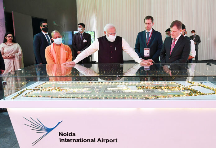 Prime Minister Narendra Modi visiting an exhibition on Noida International Airport