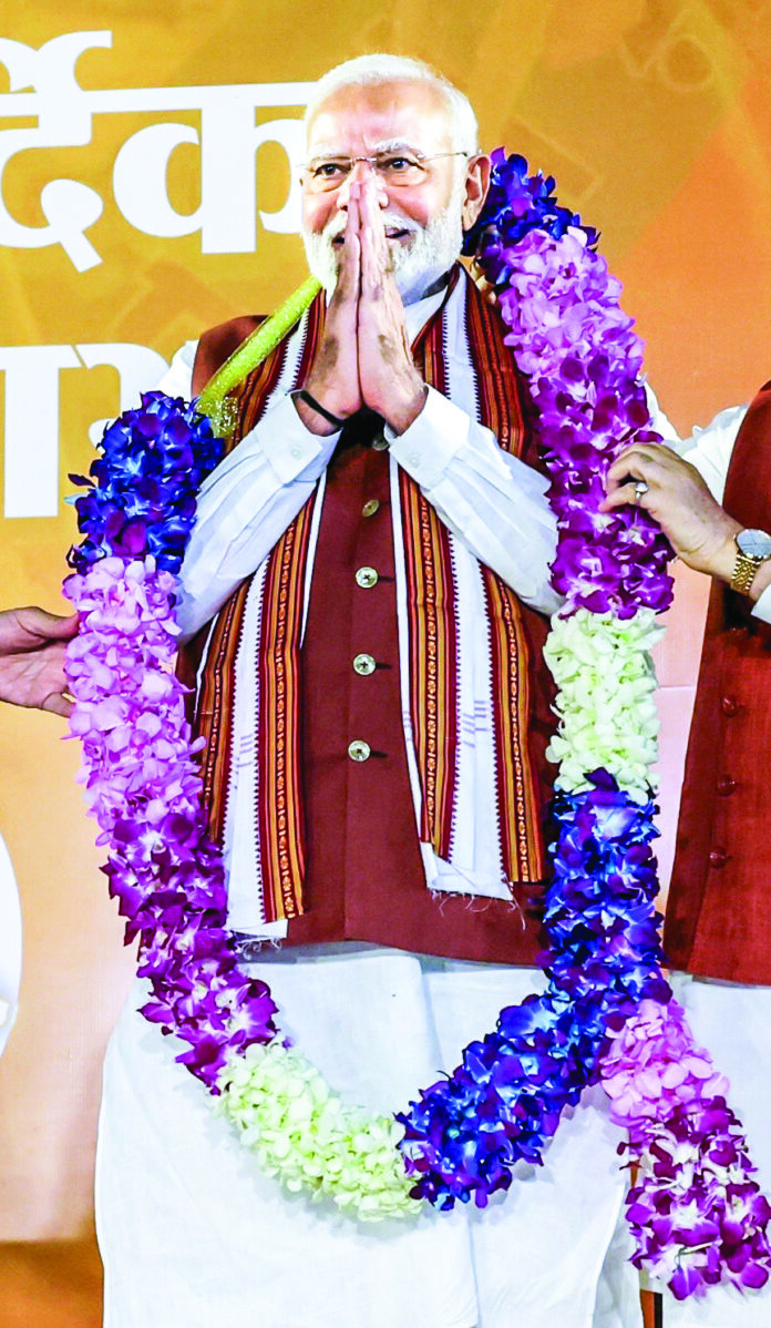 PM Narendra Modi being garlanded during a programme celebrating BJP victory in the Haryana Assembly elections, at party headquarters in New Delhi on Tuesday. ANI PM Narendra Modi being garlanded during a programme celebrating BJP victory in the Haryana Assembly elections, at party headquarters in New Delhi on Tuesday. ANI