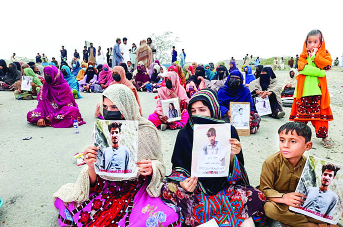 Members of the Baloch Yakjehti Committee stage a sit-in protest over alleged Pakistan’s atrocities against Baloch people, in Balochistan recently. ANI