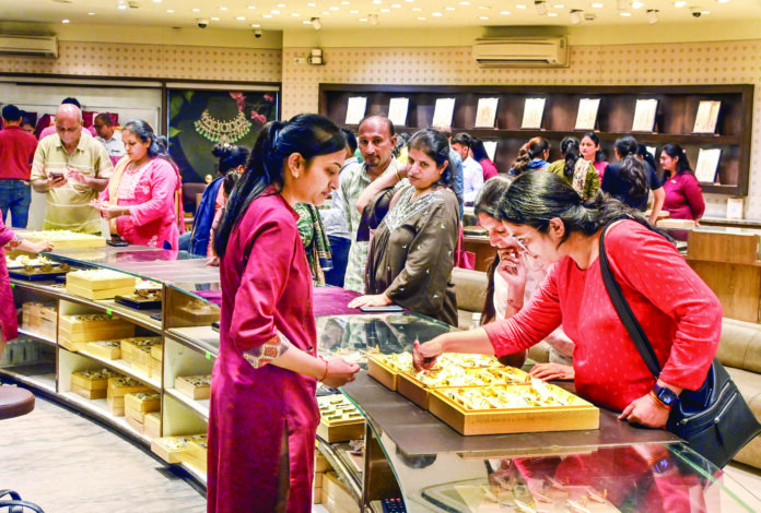 Women shop gold and silver jewelry on the occasion of ‘Pushya Nakshatra’ ahead of Diwali festival, in Ahmedabad on Thursday. ANI Women shop gold and silver jewelry on the occasion of ‘Pushya Nakshatra’ ahead of Diwali festival, in Ahmedabad on Thursday. ANI