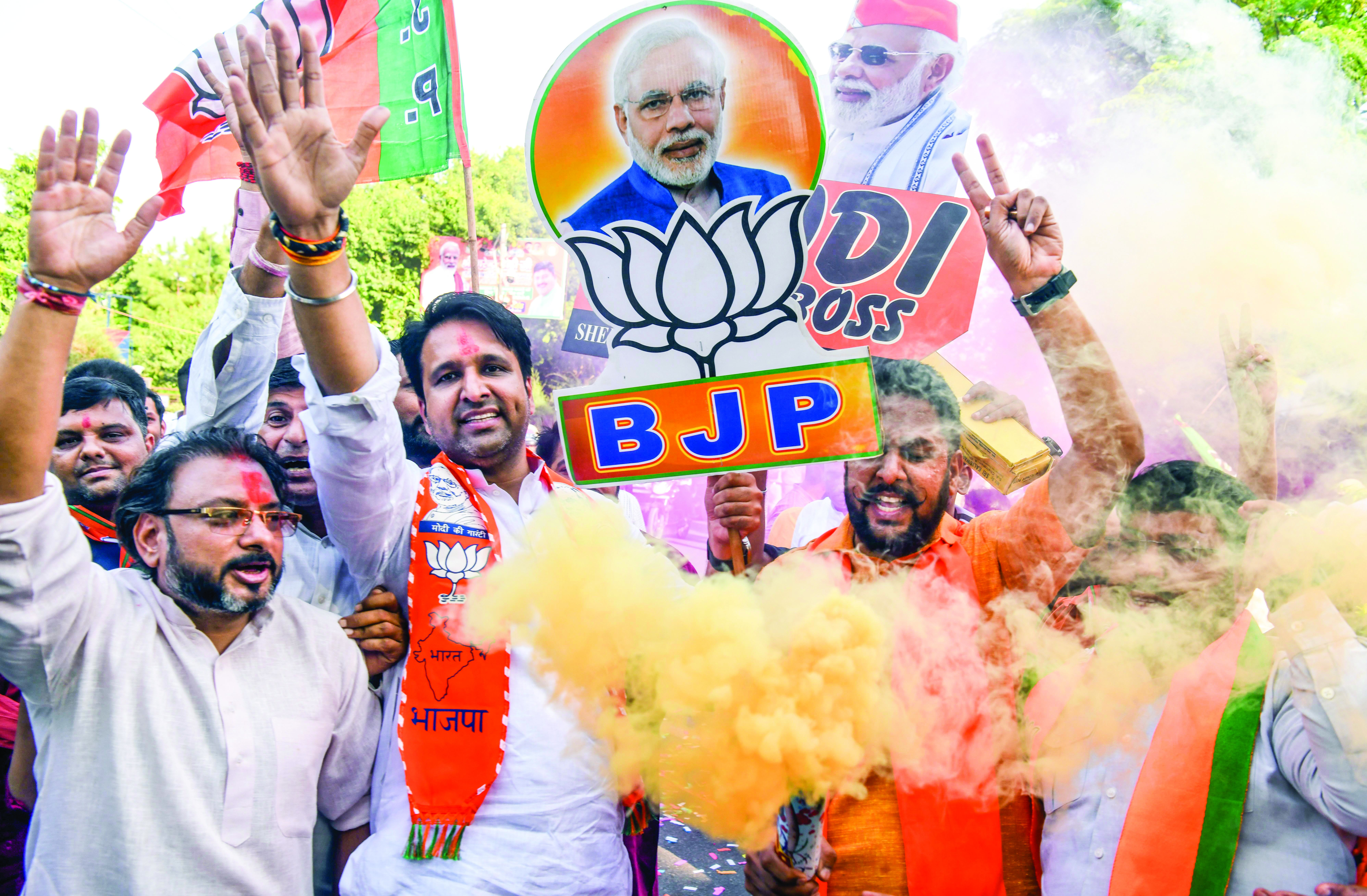 Bharatiya Janata Party supporters celebrate the party’s lead during the counting of votes for the Haryana Assembly elections, at BJP headquarters in New Delhi on 8 October 2024. ANI Bharatiya Janata Party supporters celebrate the party’s lead during the counting of votes for the Haryana Assembly elections, at BJP headquarters in New Delhi on 8 October 2024. ANI