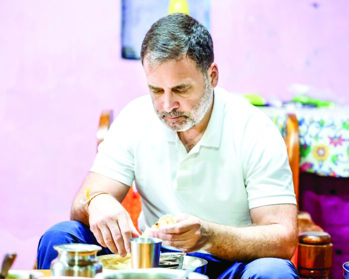 Lok Sabha LoP and Congress leader Rahul Gandhi eats at the house of a Dalit couple, in Kolhapur on Monday. ANI Lok Sabha LoP and Congress leader Rahul Gandhi eats at the house of a Dalit couple, in Kolhapur on Monday. ANI