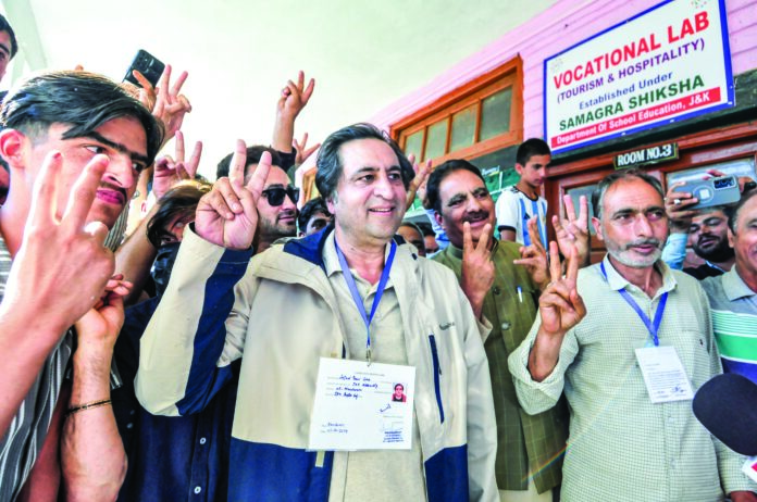 Sajad Gani Lone with his supporters after casting his vote in the Jammu and Kashmir Assembly elections, at Handwara in Kupwara on Oct 1, 2024. ANI Sajad Gani Lone with his supporters after casting his vote in the Jammu and Kashmir Assembly elections, at Handwara in Kupwara on Oct 1, 2024. ANI