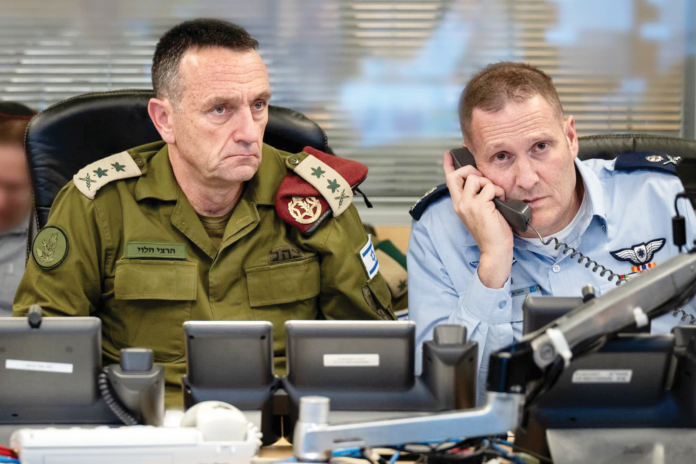 Israel’s Chief of the General Staff, LTG Herzi Halevi, commanding the strike on Iran from the Israeli Air Force underground command center in Camp Rabin (The Kirya) with the Commanding Officer of the Israeli Air Force, Maj. Gen. Tomer Bar. Photo courtesy: Israel Defense Forces’ account on X. Israel’s Chief of the General Staff, LTG Herzi Halevi, commanding the strike on Iran from the Israeli Air Force underground command center in Camp Rabin (The Kirya) with the Commanding Officer of the Israeli Air Force, Maj. Gen. Tomer Bar. Photo courtesy: Israel Defense Forces’ account on X.