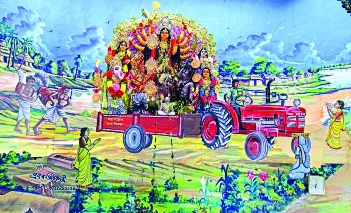 A view of a painting from a community puja pandal based on the theme of Maa Durga on a tractor during Durga Puja festival, at Papuri village in West Bengal’s Birbhum district on Friday. ANI A view of a painting from a community puja pandal based on the theme of Maa Durga on a tractor during Durga Puja festival, at Papuri village in West Bengal’s Birbhum district on Friday. ANI