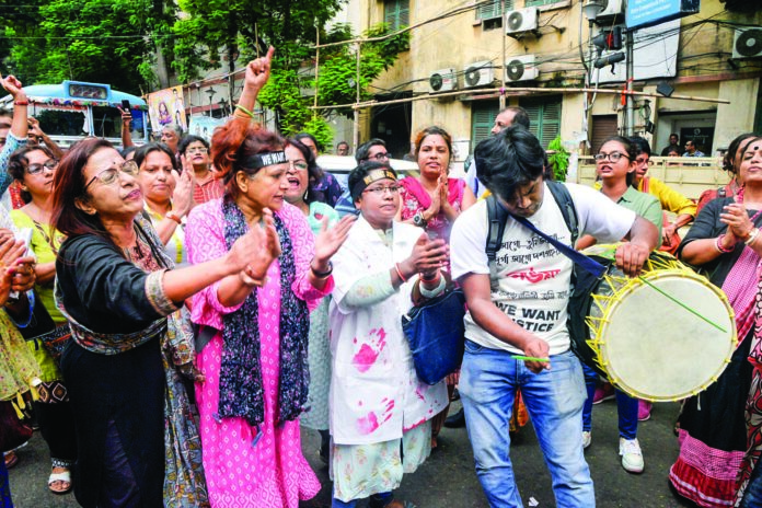 Healthcare professionals take out an “Abhaya Parikrama” rally to protest against the RG Kar rape and murder case during Durga Puja, in Kolkata on Wednesday. ANI Healthcare professionals take out an “Abhaya Parikrama” rally to protest against the RG Kar rape and murder case during Durga Puja, in Kolkata on Wednesday. ANI
