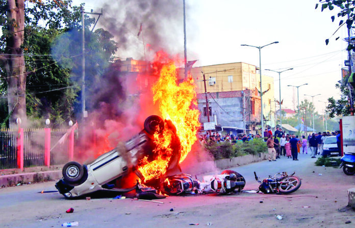 Protestors set vehicles on fire during a protest to condemn the alleged killing of women and children by suspected Kuki militants, in Imphal on Saturday. ANI Protestors set vehicles on fire during a protest to condemn the alleged killing of women and children by suspected Kuki militants, in Imphal on Saturday. ANI