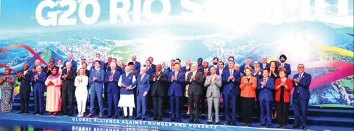PM Modi, US President Joe Biden, Brazilian President Luiz InĂ¡cio Lula da Silva, Chinese President Xi Jinping, Italian PM Giorgia Meloni and other world leaders pose for a group photo during the G20 summit, in Rio de Janeiro on Tuesday. PM Modi, US President Joe Biden, Brazilian President Luiz InĂ¡cio Lula da Silva, Chinese President Xi Jinping, Italian PM Giorgia Meloni and other world leaders pose for a group photo during the G20 summit, in Rio de Janeiro on Tuesday.