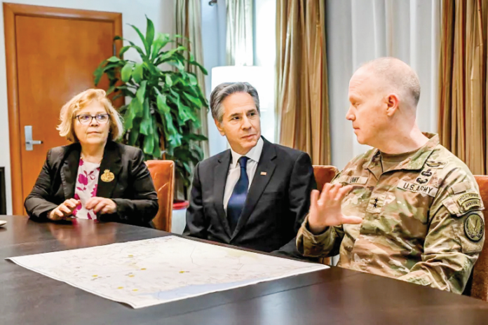 US Secretary of State Antony Blinken, centre, attends a briefing with US Major General Kevin Leahy, commander of the Combined Joint Task Force in Baghdad, Iraq, on Friday. US Secretary of State Antony Blinken, centre, attends a briefing with US Major General Kevin Leahy, commander of the Combined Joint Task Force in Baghdad, Iraq, on Friday.