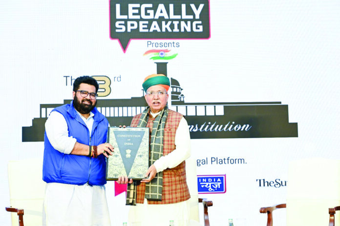 Rajya Sabha MP Kartikeya Sharma presents a copy of the Constituion of India to Law and Justice Minister Arjun Ram Meghwal on the stage of 3rd Law & Constitution Dialogue in New Delhi. Rajya Sabha MP Kartikeya Sharma presents a copy of the Constituion of India to Law and Justice Minister Arjun Ram Meghwal on the stage of 3rd Law & Constitution Dialogue in New Delhi.