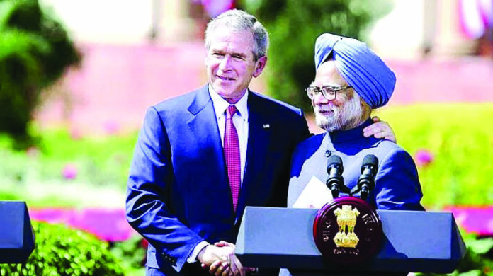 US President George Bush shakes hands with Prime Minister Manmohan Singh in New Delhi on 2 March 2006. Photo: White House US President George Bush shakes hands with Prime Minister Manmohan Singh in New Delhi on 2 March 2006. Photo: White House
