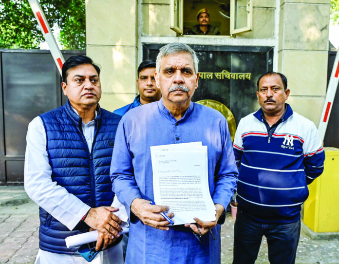Congress leader Sandeep Dikshit submits a complaint to Delhi Lieutenant Governor Vinai Kumar Saxena against AAP National Convenor and former CM Arvind Kejriwal over AAP’s proposed schemes for Rs 2100 monthly allowance for women, in New Delhi on Thursday. ANI Congress leader Sandeep Dikshit submits a complaint to Delhi Lieutenant Governor Vinai Kumar Saxena against AAP National Convenor and former CM Arvind Kejriwal over AAP’s proposed schemes for Rs 2100 monthly allowance for women, in New Delhi on Thursday. ANI
