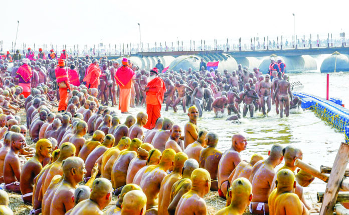 Newly initiated Naga sadhus of Shri Panch Dashnaam Juna Akhada perform rituals during the Maha Kumbh Mela 2025, at Sangam in Prayagraj on Saturday. (ANI) Newly initiated Naga sadhus of Shri Panch Dashnaam Juna Akhada perform rituals during the Maha Kumbh Mela 2025, at Sangam in Prayagraj on Saturday. (ANI)