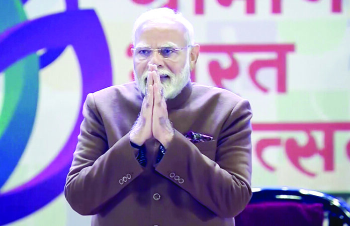 PM Modi greets the gathering during the inauguration of Grameen Bharat Mahotsav 2025, at Bharat Mandapam in New Delhi on Saturday. ANI PM Modi greets the gathering during the inauguration of Grameen Bharat Mahotsav 2025, at Bharat Mandapam in New Delhi on Saturday. ANI