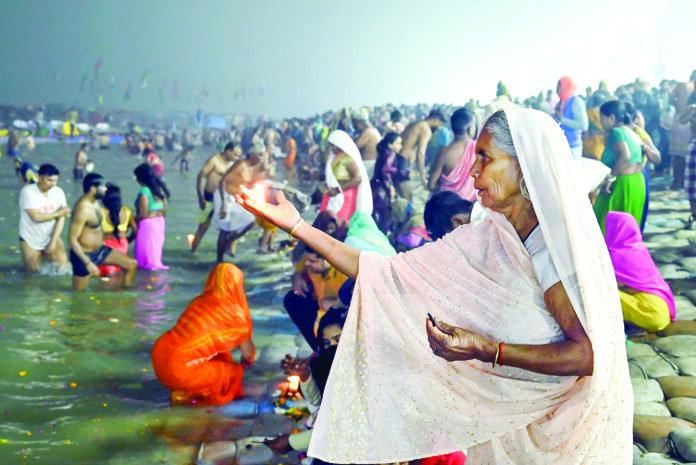 A devotee offers prayers at Triveni Sangam on the occasion of Paush Purnima during Maha Kumbh 2025, in Prayagraj on 13 January. ANI A devotee offers prayers at Triveni Sangam on the occasion of Paush Purnima during Maha Kumbh 2025, in Prayagraj on 13 January. ANI