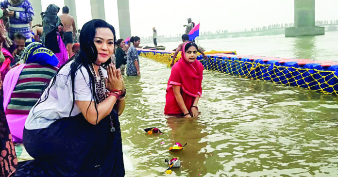 A foreign tourist offers prayers at Triveni Sangam on the occasion of Paush Purnima during the Maha Kumbh 2025, in Prayagraj on 13 January. ANI A foreign tourist offers prayers at Triveni Sangam on the occasion of Paush Purnima during the Maha Kumbh 2025, in Prayagraj on 13 January. ANI