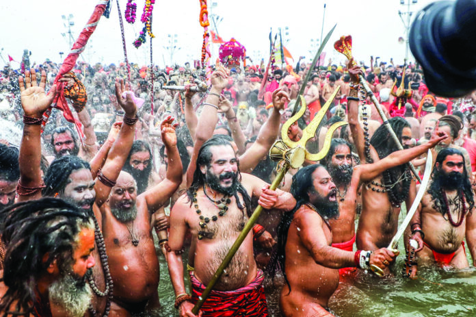 Naga sadhus take Amrit Snan at Triveni Sangam on the occasion of Makar Sankranti during the Maha Kumbh 2025, in Prayagraj on 14 January. ANI Naga sadhus take Amrit Snan at Triveni Sangam on the occasion of Makar Sankranti during the Maha Kumbh 2025, in Prayagraj on 14 January. ANI